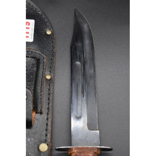 1767 - Two Bowie knives and leather sheaths, the blades 17.5cm and 12.5cm respectively.... 