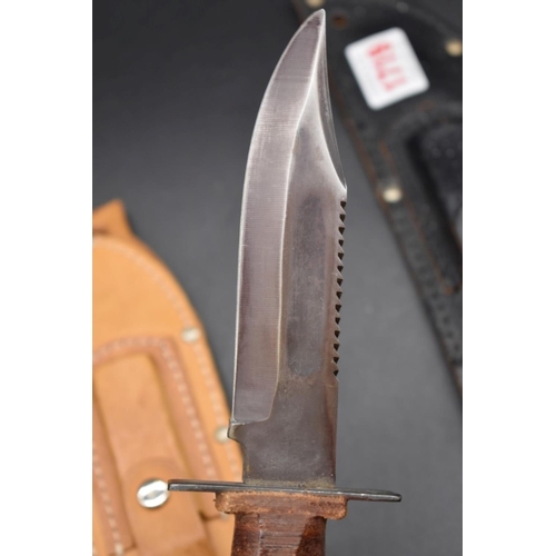 1767 - Two Bowie knives and leather sheaths, the blades 17.5cm and 12.5cm respectively.... 