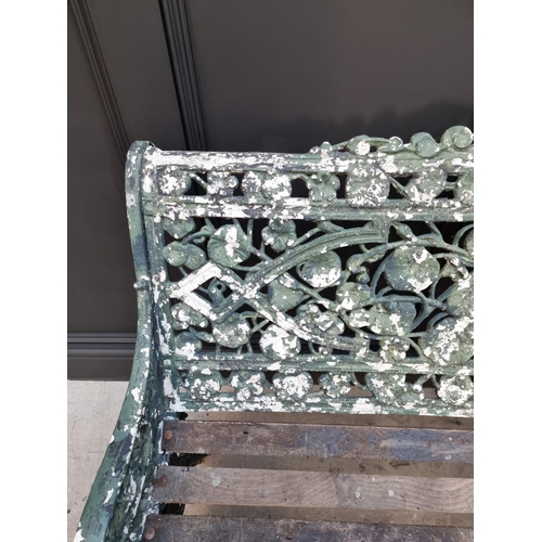 1809 - An old green painted aluminium garden bench, 131cm wide.