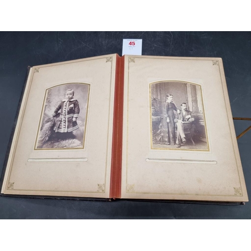 45 - CARTE DE VISITE ALBUM: Chichester & Brighton: album of approx 74 carte de visite and cabine... 