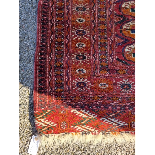 1004 - A Bokhara rug, having repeated decoration allover, 174 x 132cm. 