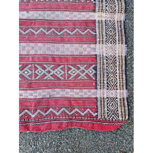 1005 - A Persian rug, having geometric design allover, 172 x 65cm. 