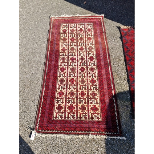 1011 - A Persian rug, having repeated geometric design to central field, with geometric borders, 186 x 94cm... 