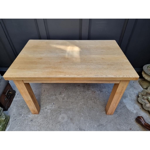 1024 - A modern pale oak kitchen table, 122cm long. 