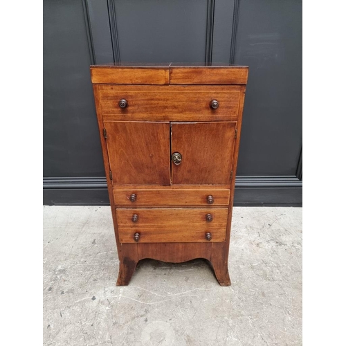 1027 - A George III mahogany and line inlaid wash stand, enclosing a rising mirror, 45cm wide.... 