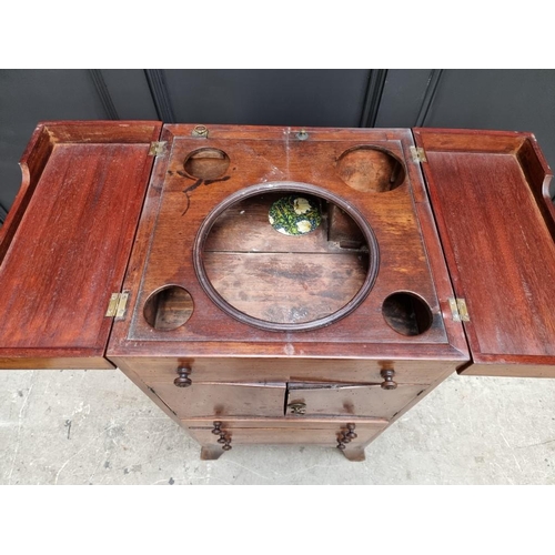 1027 - A George III mahogany and line inlaid wash stand, enclosing a rising mirror, 45cm wide.... 