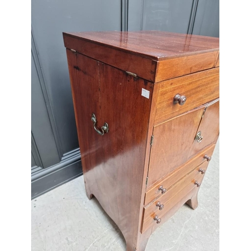 1027 - A George III mahogany and line inlaid wash stand, enclosing a rising mirror, 45cm wide.... 