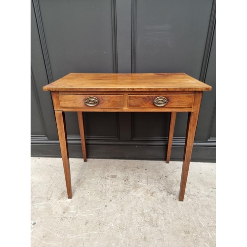 1031 - A George III mahogany and line inlaid two drawer side table, 76.5cm wide. 