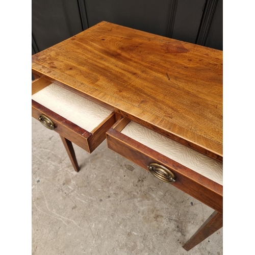 1031 - A George III mahogany and line inlaid two drawer side table, 76.5cm wide. 