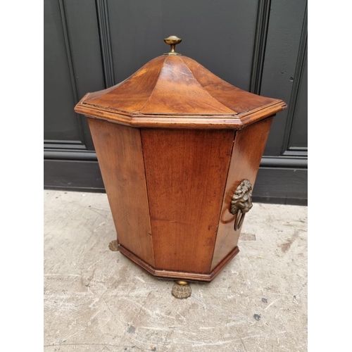 1034 - An antique mahogany coal box and cover, of tapered octagonal form, on brass paw feet, 42cm wide.&nbs... 