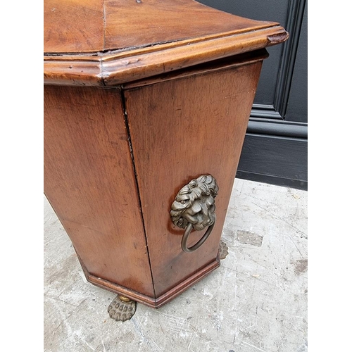 1034 - An antique mahogany coal box and cover, of tapered octagonal form, on brass paw feet, 42cm wide.&nbs... 