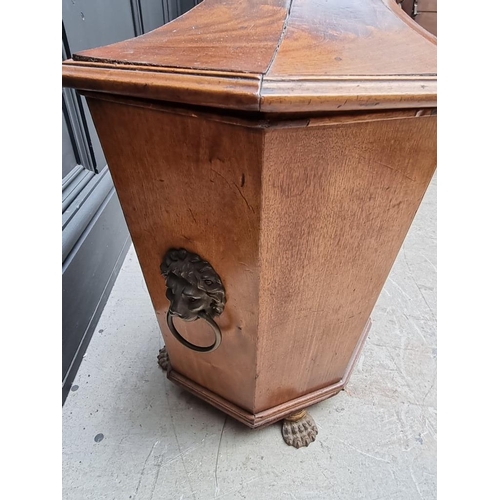 1034 - An antique mahogany coal box and cover, of tapered octagonal form, on brass paw feet, 42cm wide.&nbs... 