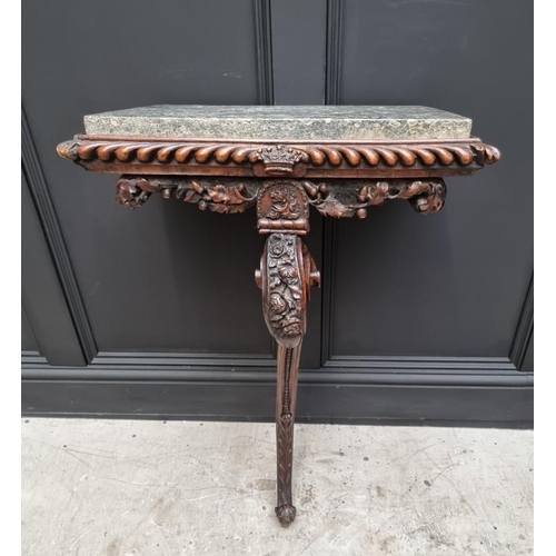 1036 - An interesting 19th century carved oak console table, with green marble top above a gadrooned frieze... 