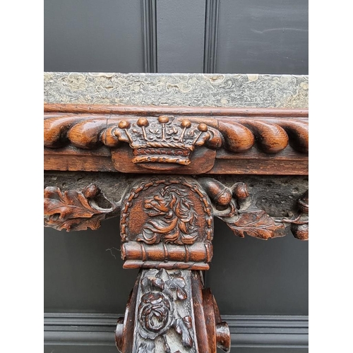 1036 - An interesting 19th century carved oak console table, with green marble top above a gadrooned frieze... 