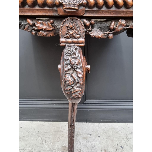 1036 - An interesting 19th century carved oak console table, with green marble top above a gadrooned frieze... 