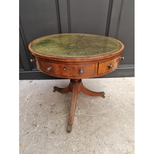 1041 - A small George III and later mahogany drum top library table, with leather inset surface above ... 