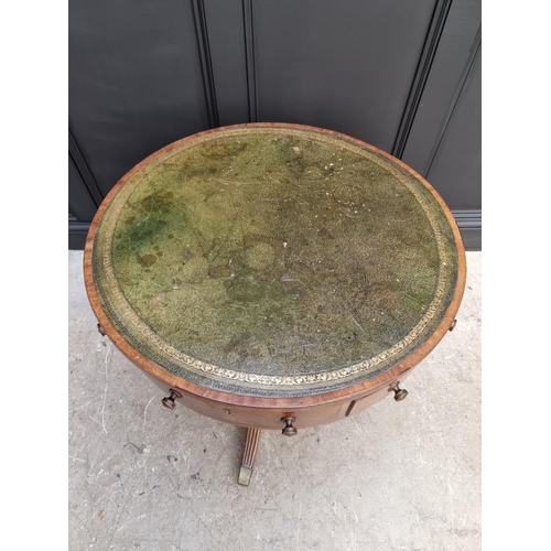 1041 - A small George III and later mahogany drum top library table, with leather inset surface above ... 