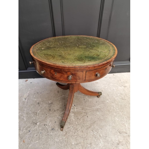 1041 - A small George III and later mahogany drum top library table, with leather inset surface above ... 