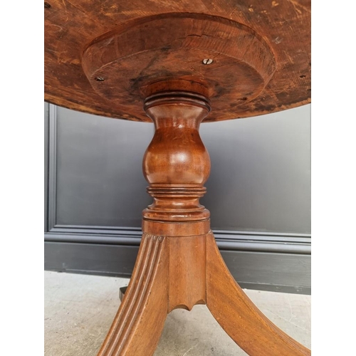 1041 - A small George III and later mahogany drum top library table, with leather inset surface above ... 