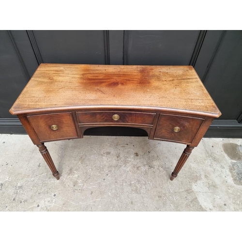 1044 - An early 19th century mahogany concave fronted table, in the manner of Gillows, 104.5cm wide. ... 