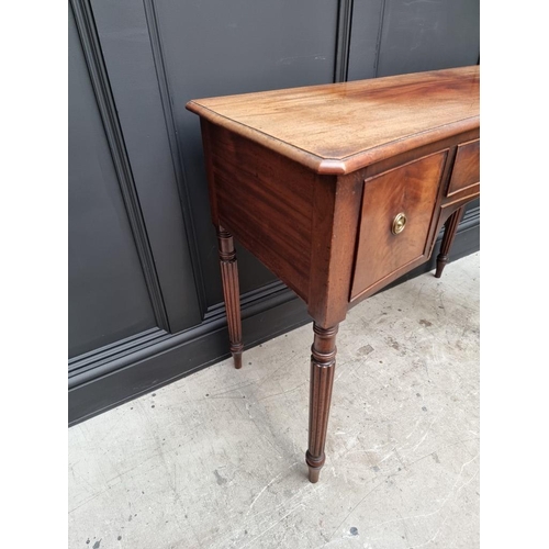 1044 - An early 19th century mahogany concave fronted table, in the manner of Gillows, 104.5cm wide. ... 