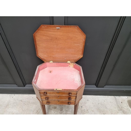 1045 - An early 19th century mahogany octagonal work table, with hinged top and frieze drawer, 49cm wide.&n... 