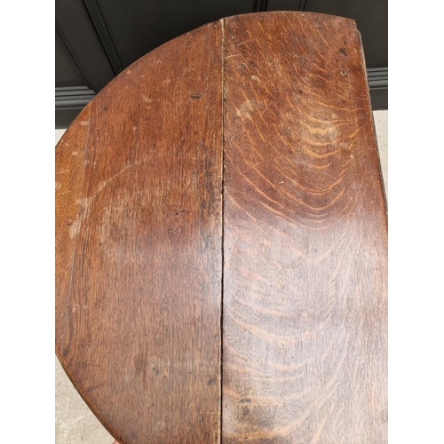 1050 - An antique oak gateleg table, 89cm wide. 