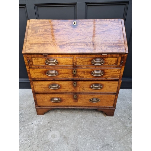 1051 - A George III mahogany and crossbanded bureau, 92.5cm wide. 