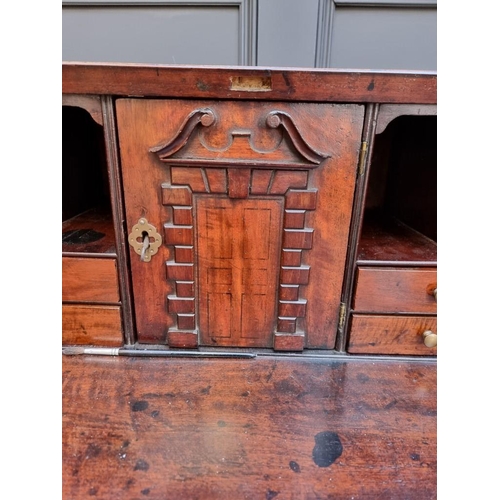 1051 - A George III mahogany and crossbanded bureau, 92.5cm wide. 