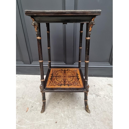 1056 - An unusual late 19th century Egyptian revival ebonized and inlaid occasional table, the top inset wi... 