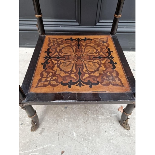 1056 - An unusual late 19th century Egyptian revival ebonized and inlaid occasional table, the top inset wi... 