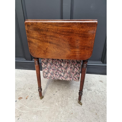 1057 - An early 19th century mahogany Pembroke work table, 47cm wide. 