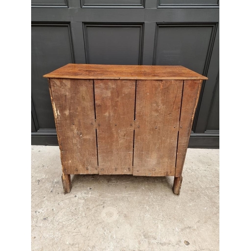 1058 - An 18th century oak three drawer chest, with moulded frieze, 89.5cm wide. 