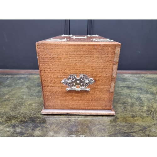 1059 - A Victorian oak and brass mounted stationary casket, 31cm wide. 