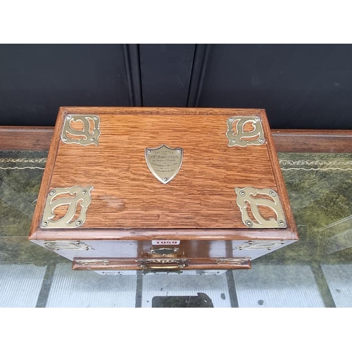 1059 - A Victorian oak and brass mounted stationary casket, 31cm wide. 