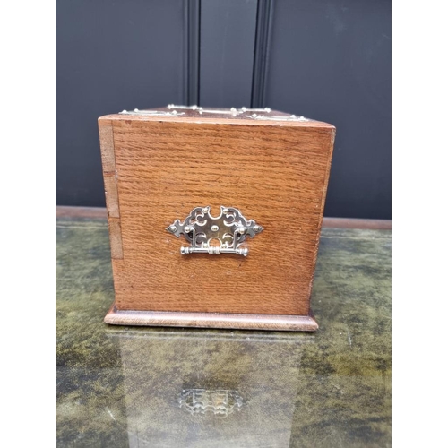 1059 - A Victorian oak and brass mounted stationary casket, 31cm wide. 