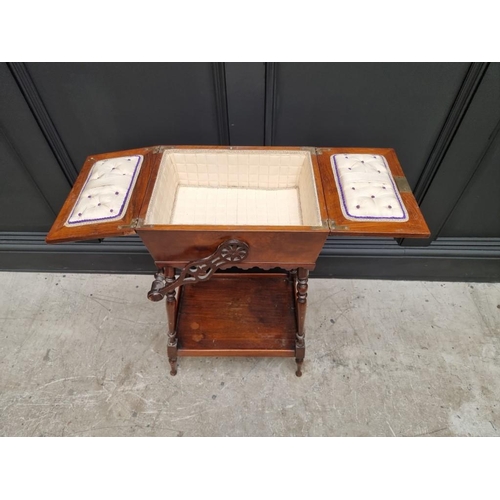 1061 - An antique mahogany work box on stand, 43cm wide at base. 