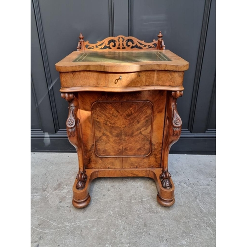 1062 - A Victorian figured walnut Davenport, 53.5cm wide.