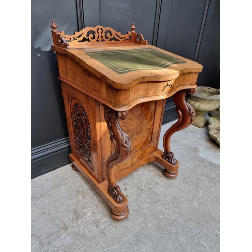 1062 - A Victorian figured walnut Davenport, 53.5cm wide.