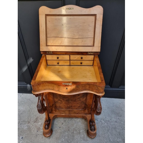 1062 - A Victorian figured walnut Davenport, 53.5cm wide.