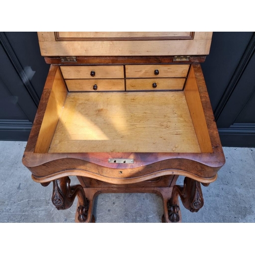 1062 - A Victorian figured walnut Davenport, 53.5cm wide.