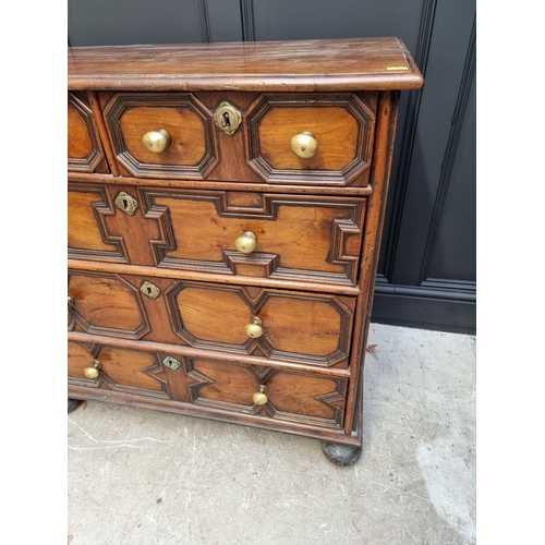 1063 - A rare late 17th century solid walnut geometrically moulded chest of drawers, on bun feet, 98.5cm wi... 