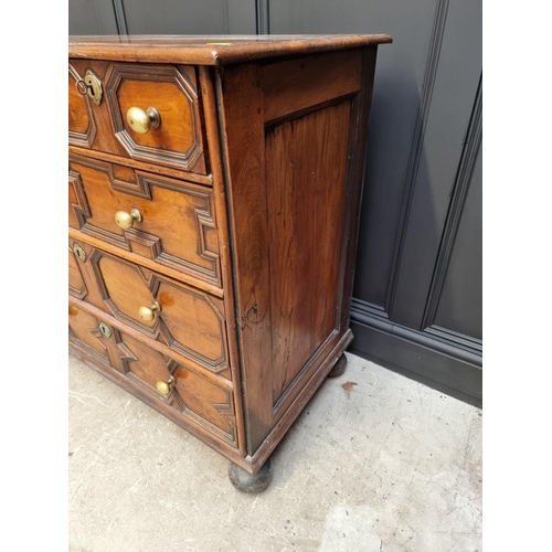 1063 - A rare late 17th century solid walnut geometrically moulded chest of drawers, on bun feet, 98.5cm wi... 