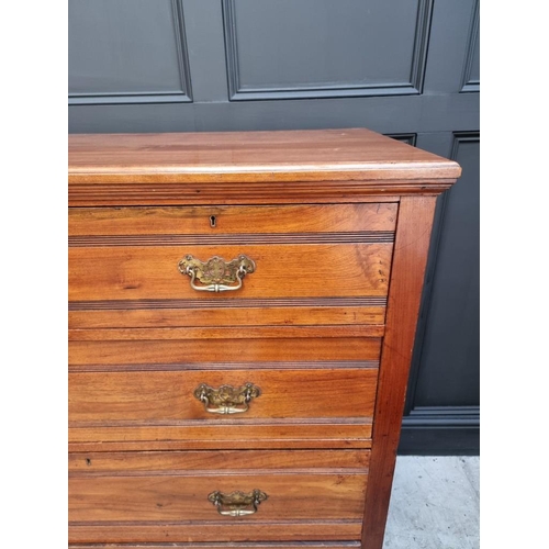 1069 - A late Victorian walnut chest of drawers, stamped 'Jas Shoolbred & Co' and numbered 989, 122cm w... 