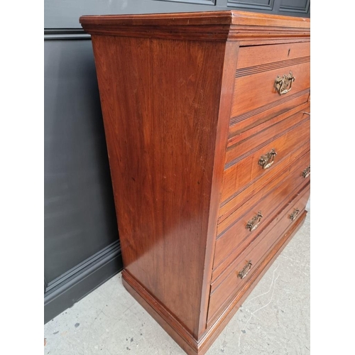 1069 - A late Victorian walnut chest of drawers, stamped 'Jas Shoolbred & Co' and numbered 989, 122cm w... 