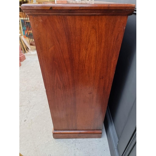 1069 - A late Victorian walnut chest of drawers, stamped 'Jas Shoolbred & Co' and numbered 989, 122cm w... 