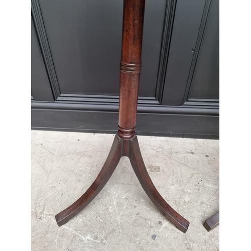 1071 - A pair of mahogany tripod tables, with brass edged octagonal tops, 40.5cm wide.