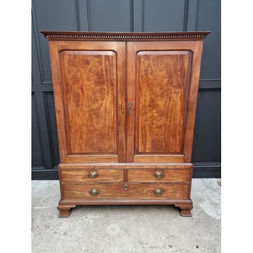 1072 - A small George III mahogany linen press, possibly Channel Islands, Guernsey, enclosing hanging space... 