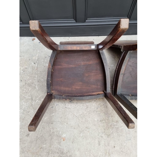 1075 - An interesting set of three George III shield back hall chairs, each with painted lion crest to back... 