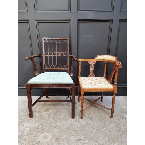 1076 - A late 19th/early 20th century Gothic style mahogany elbow chair; together with another mahogan... 